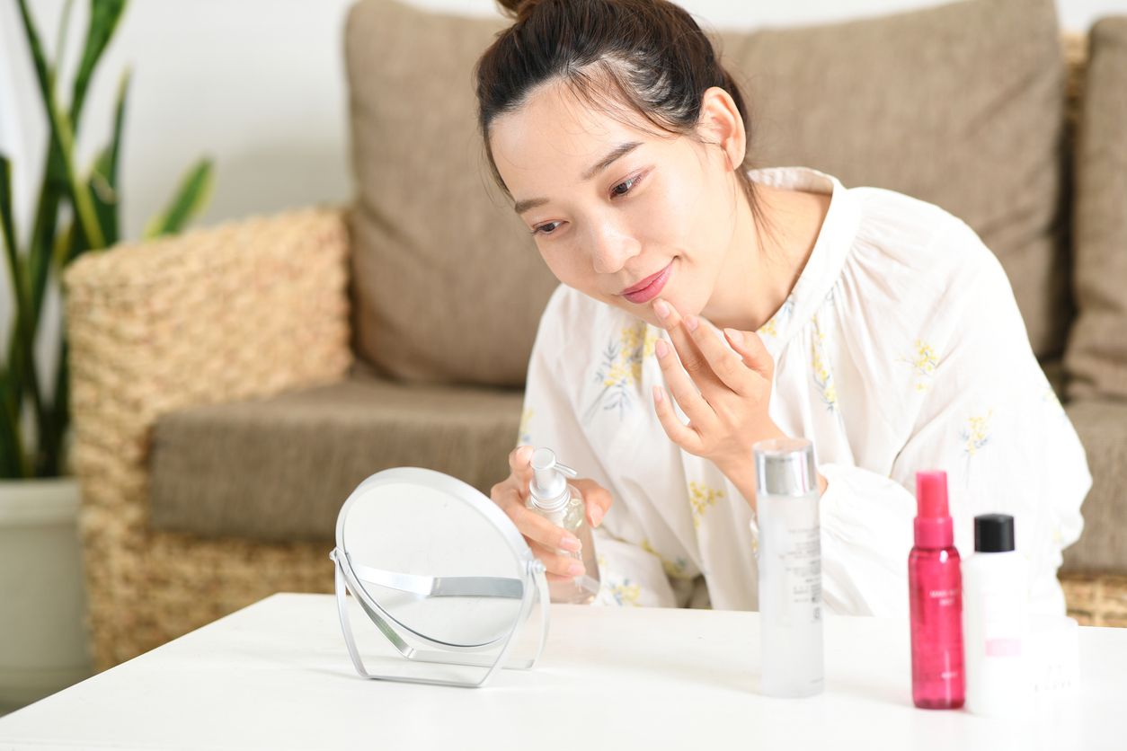 Woman applying personalized skincare routine