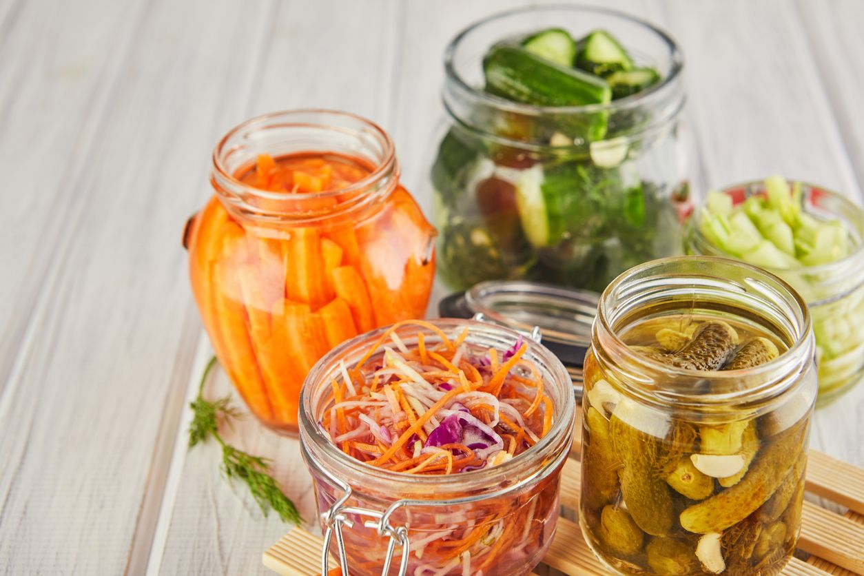 Open jars of fermented ingredients for skincare